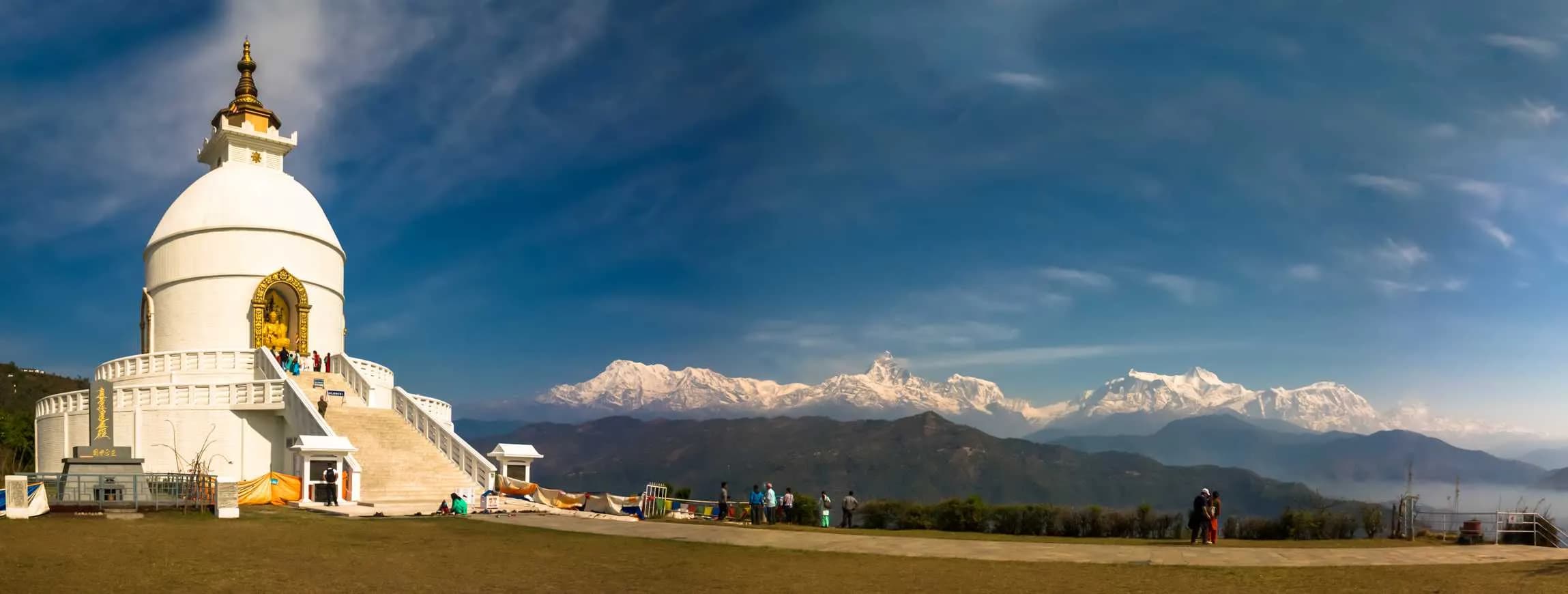 World Peace Pagoda on a hill with a panoramic view of the snow-capped Annapurna mountains World Peace Pagoda on a hill with a panoramic view of the snow-capped Annapurna mountains